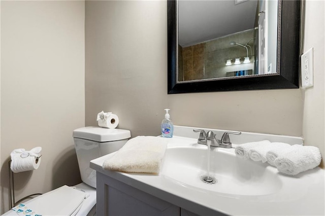 bathroom with toilet and vanity