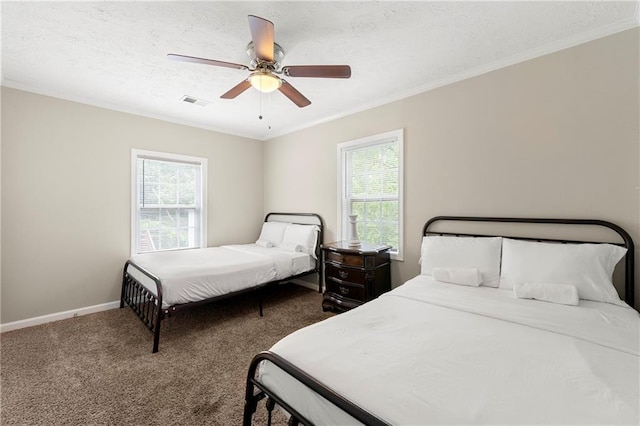 bedroom featuring carpet, baseboards, crown molding, a ceiling fan, and a textured ceiling
