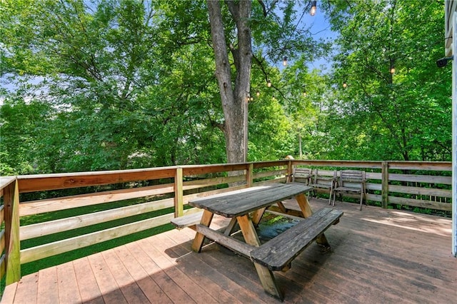 wooden deck with outdoor dining space