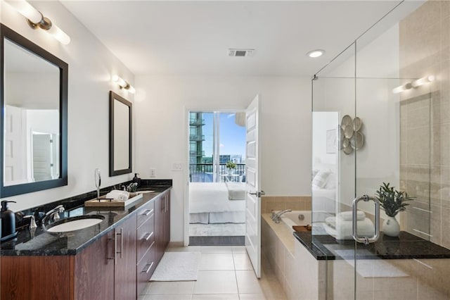 full bathroom with tile patterned floors, visible vents, a sink, ensuite bath, and double vanity