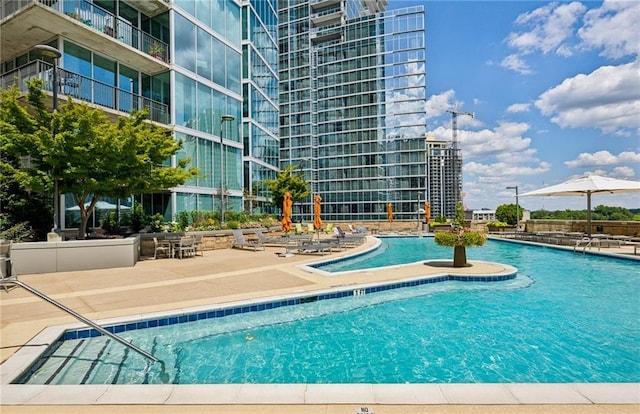 pool featuring a patio area