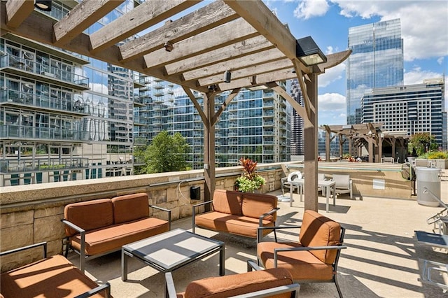 view of patio / terrace featuring an outdoor hangout area, a view of city, and a pergola