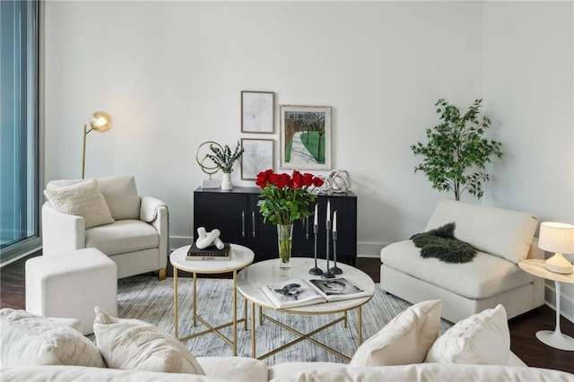 living room with baseboards and wood finished floors