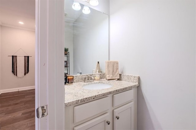 bathroom with wood-type flooring and vanity