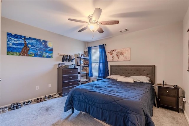 carpeted bedroom with ceiling fan