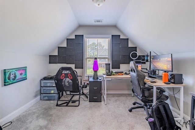 office space featuring vaulted ceiling and light colored carpet