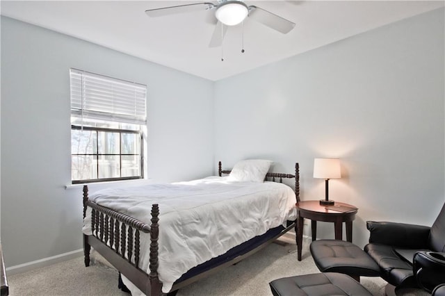 bedroom with ceiling fan and light colored carpet