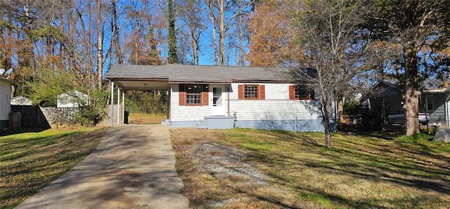 ranch-style house featuring a front yard and a carport