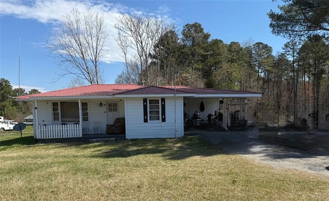 1561 Demorest Mount Airy Hwy, Mount Airy, GA 30563 - ranch-style home featuring covered porch, a front yard, a metal roof, and asphalt driveway