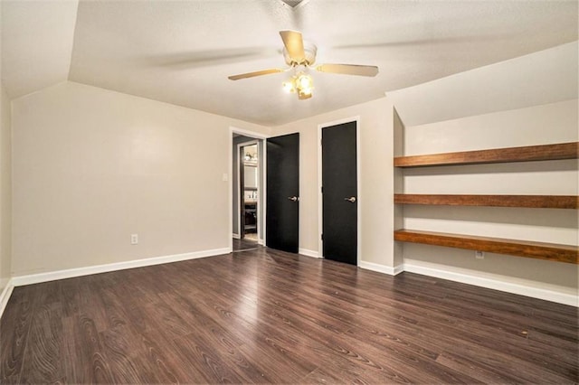 unfurnished bedroom with dark wood-type flooring, ceiling fan, and lofted ceiling