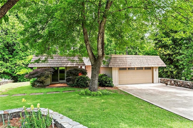 1075 Winding Branch Ln, Atlanta, GA 30338 - view of front of house featuring mansard roof, concrete driveway, a front yard, an outdoor structure, and an attached garage