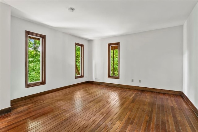 1075 Winding Branch Ln, Atlanta, GA 30338 - spare room with hardwood / wood-style floors, baseboards, and a smoke detector