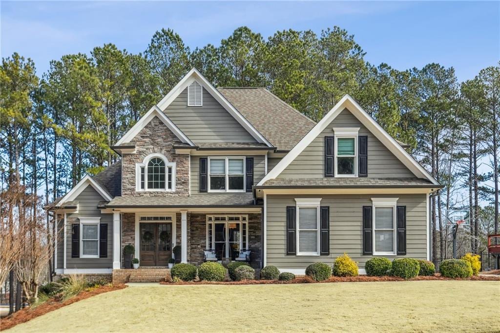 craftsman-style home featuring a front yard and a porch