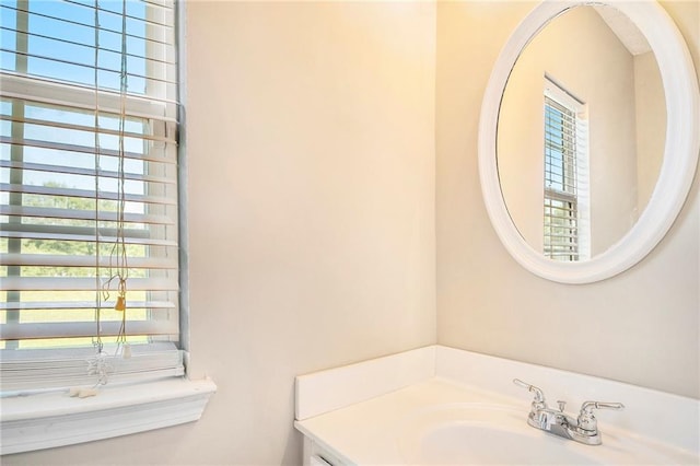 bathroom featuring plenty of natural light and a sink