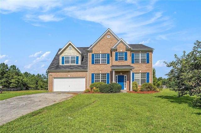 colonial inspired home with driveway, a garage, a front lawn, and brick siding