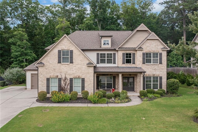4460 Hunters Walk Way, Cumming, GA 30028 - view of front facade featuring driveway, brick siding, and a shingled roof