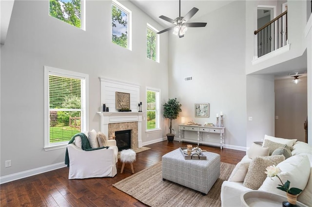 4460 Hunters Walk Way, Cumming, GA 30028 - living area with a towering ceiling, ceiling fan, a fireplace with flush hearth, and healthy amount of natural light