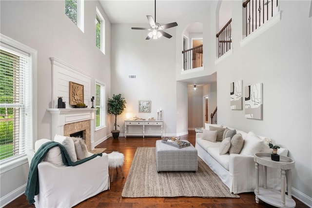 4460 Hunters Walk Way, Cumming, GA 30028 - living area featuring stairs, ceiling fan, a high ceiling, a fireplace, and dark wood finished floors