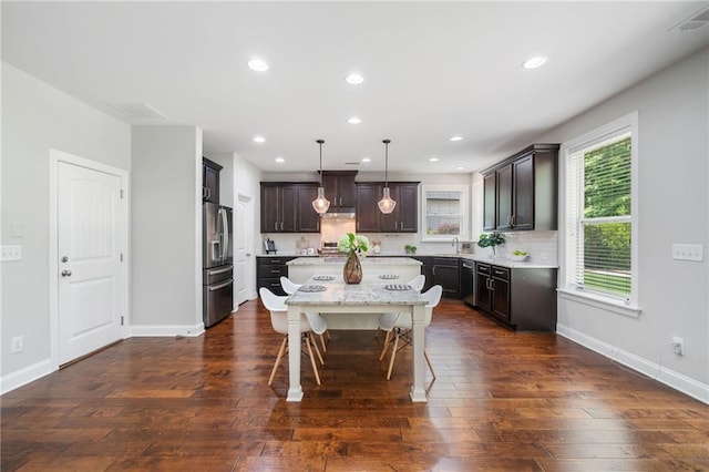 4460 Hunters Walk Way, Cumming, GA 30028 - kitchen with stainless steel fridge, a kitchen island, dark wood-style floors, tasteful backsplash, and recessed lighting