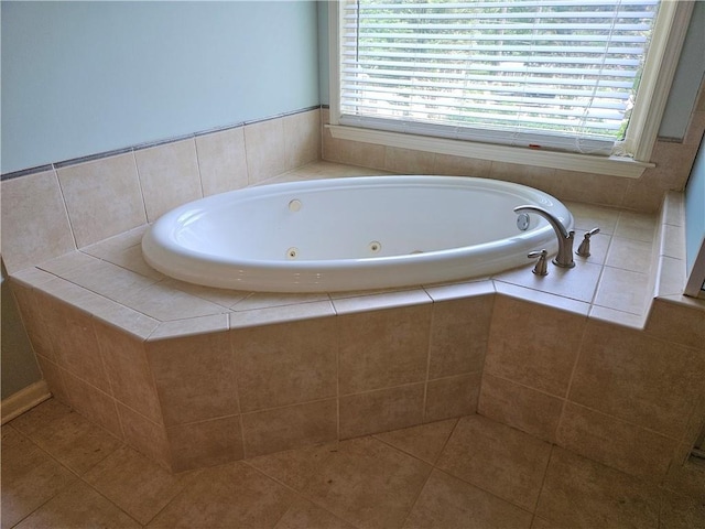 bathroom featuring a tub with jets