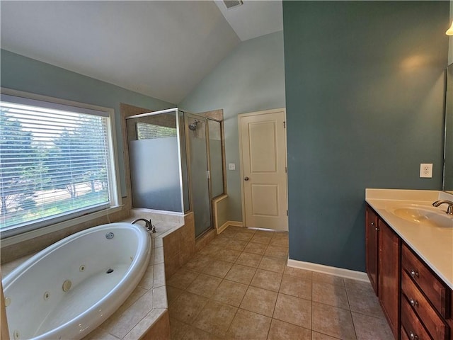 bathroom with lofted ceiling, a stall shower, a whirlpool tub, tile patterned flooring, and vanity