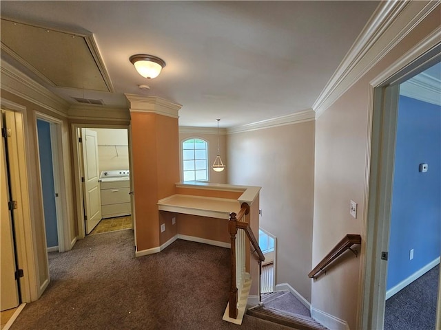 hallway featuring washer / clothes dryer, attic access, dark colored carpet, visible vents, and an upstairs landing