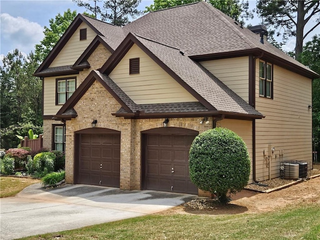 view of front facade featuring cooling unit, driveway, and roof with shingles