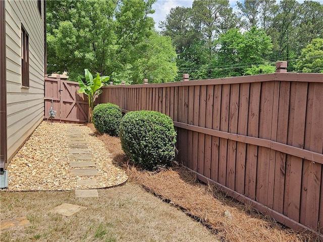 view of yard featuring a gate and fence