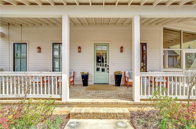 150 Ray Way, Chattahoochee Hills, GA 30268 - doorway to property featuring covered porch