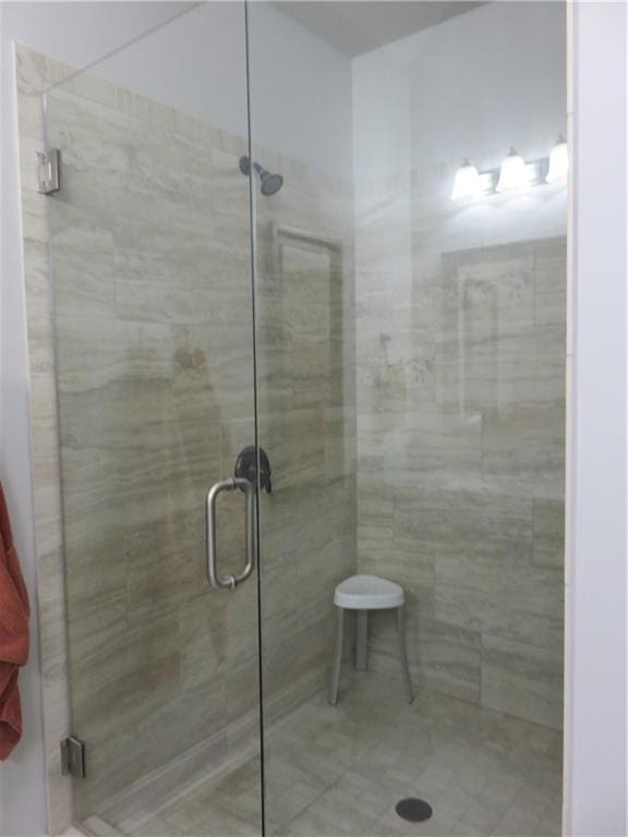 bathroom featuring an enclosed shower