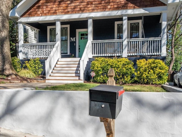 view of front of home featuring covered porch