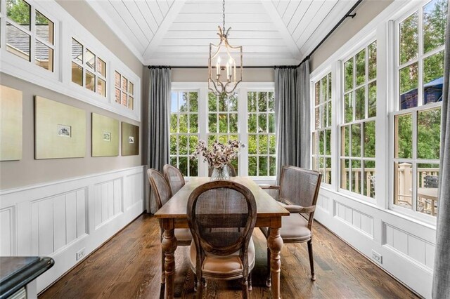 sunroom featuring an inviting chandelier and french doors