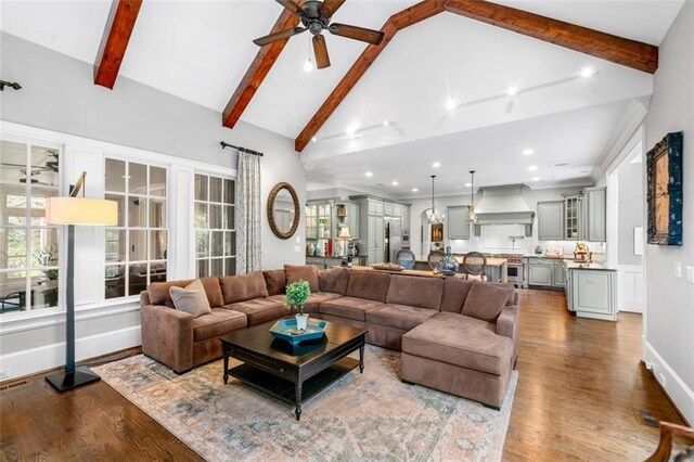living room featuring recessed lighting, ceiling fan, dark wood finished floors, and beam ceiling