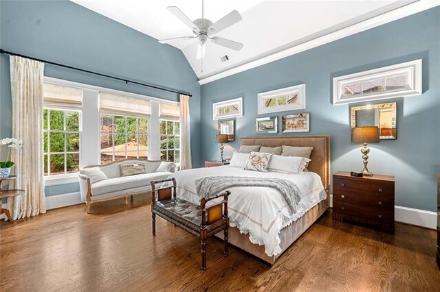 bedroom with ceiling fan, visible vents, wood finished floors, baseboards, and lofted ceiling