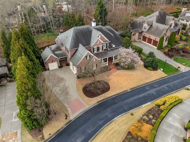 birds eye view of property with a residential view