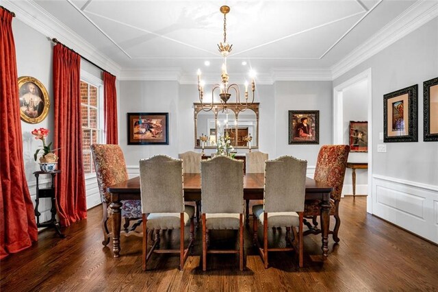dining room with wainscoting, a chandelier, dark wood-style floors, and ornamental molding