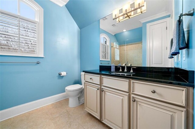 full bathroom with vanity, toilet, baseboards, tiled shower, and tile patterned floors