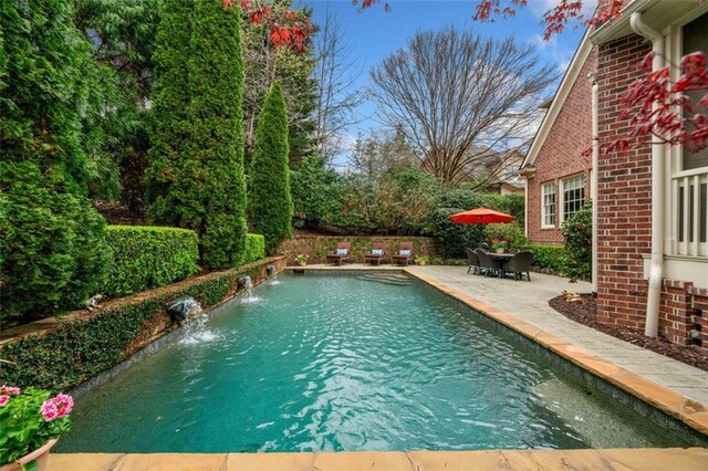 view of pool featuring a fenced in pool and a patio