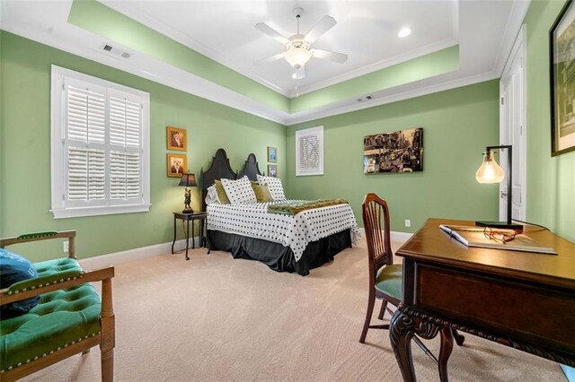 bedroom featuring visible vents, crown molding, baseboards, carpet floors, and a tray ceiling