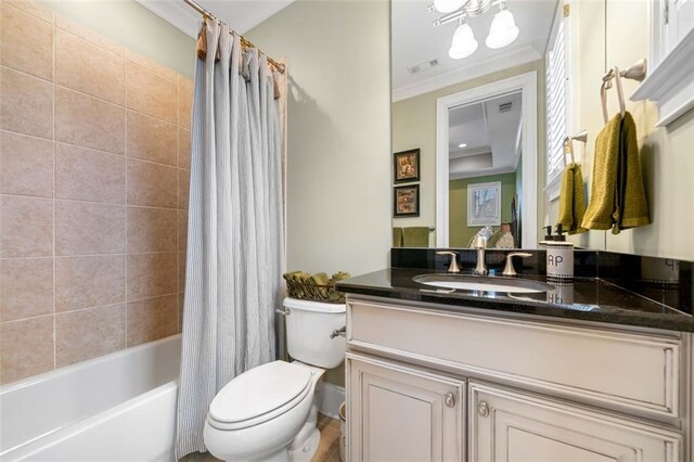 full bath featuring shower / bath combo, vanity, toilet, visible vents, and ornamental molding