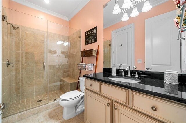 full bath with crown molding, tile patterned flooring, vanity, toilet, and a stall shower