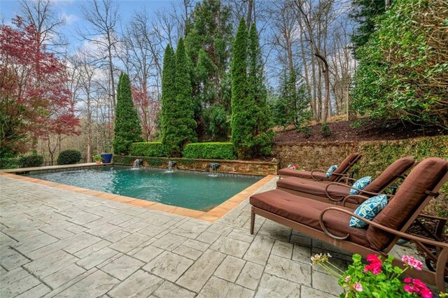 outdoor pool featuring a patio