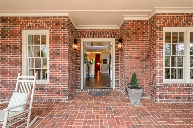 property entrance with brick siding