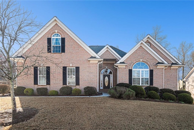 traditional-style house featuring brick siding