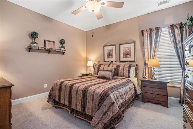 bedroom featuring baseboards, visible vents, carpet floors, and ceiling fan