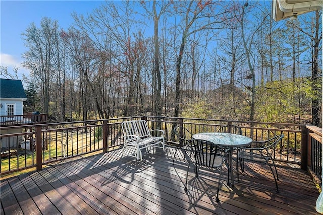 wooden deck with outdoor dining space