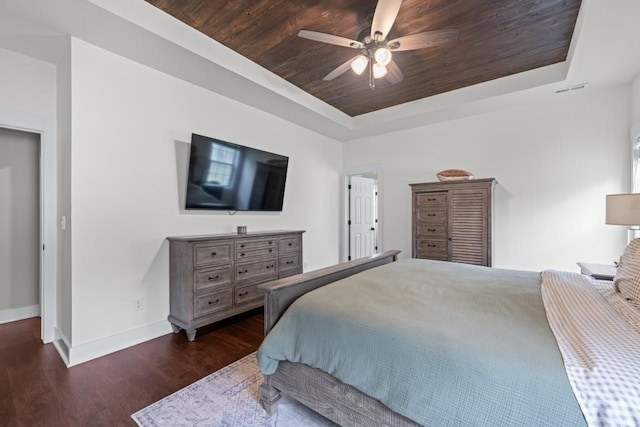 300 Olde Wick Trl, Hoschton, GA 30548 - bedroom with a tray ceiling, wooden ceiling, wood finished floors, baseboards, and ceiling fan