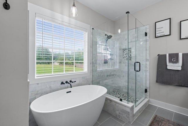 300 Olde Wick Trl, Hoschton, GA 30548 - bathroom with a freestanding bath, a shower stall, and tile patterned floors