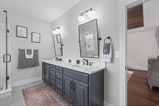 300 Olde Wick Trl, Hoschton, GA 30548 - full bath featuring a shower stall, double vanity, and baseboards
