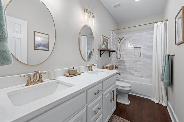 300 Olde Wick Trl, Hoschton, GA 30548 - full bathroom featuring toilet, shower / tub combo, wood finished floors, and double vanity